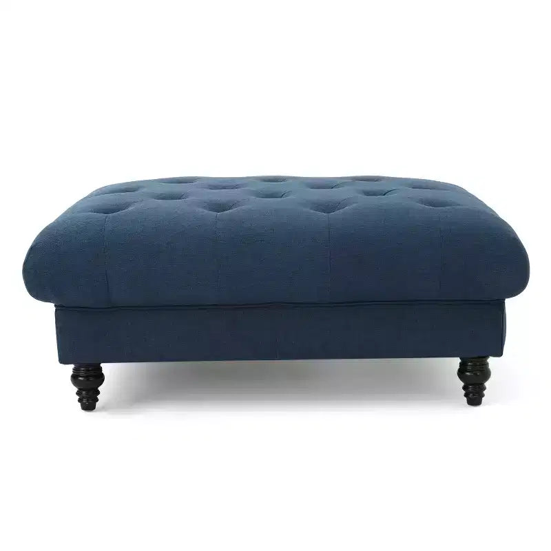 Pouf quadrato capitonné con cuciture a rombi e gambe in betulla